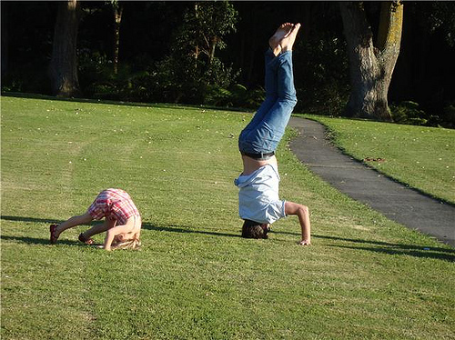 kid and dad head stand