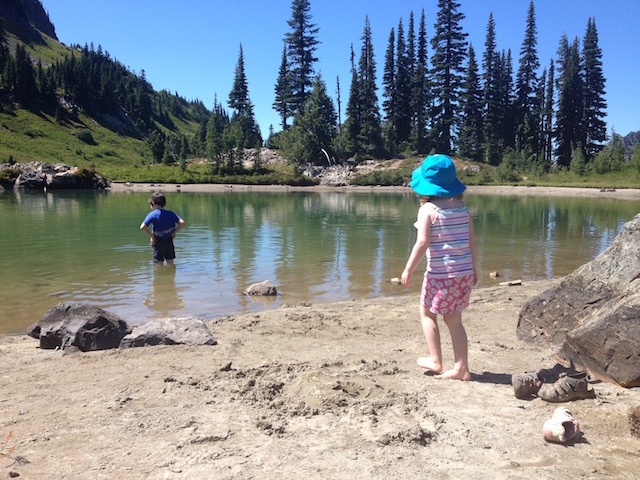 kids wading in mountain lake
