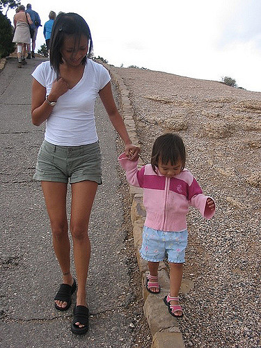 tightrope walk balance walk mom and child beach