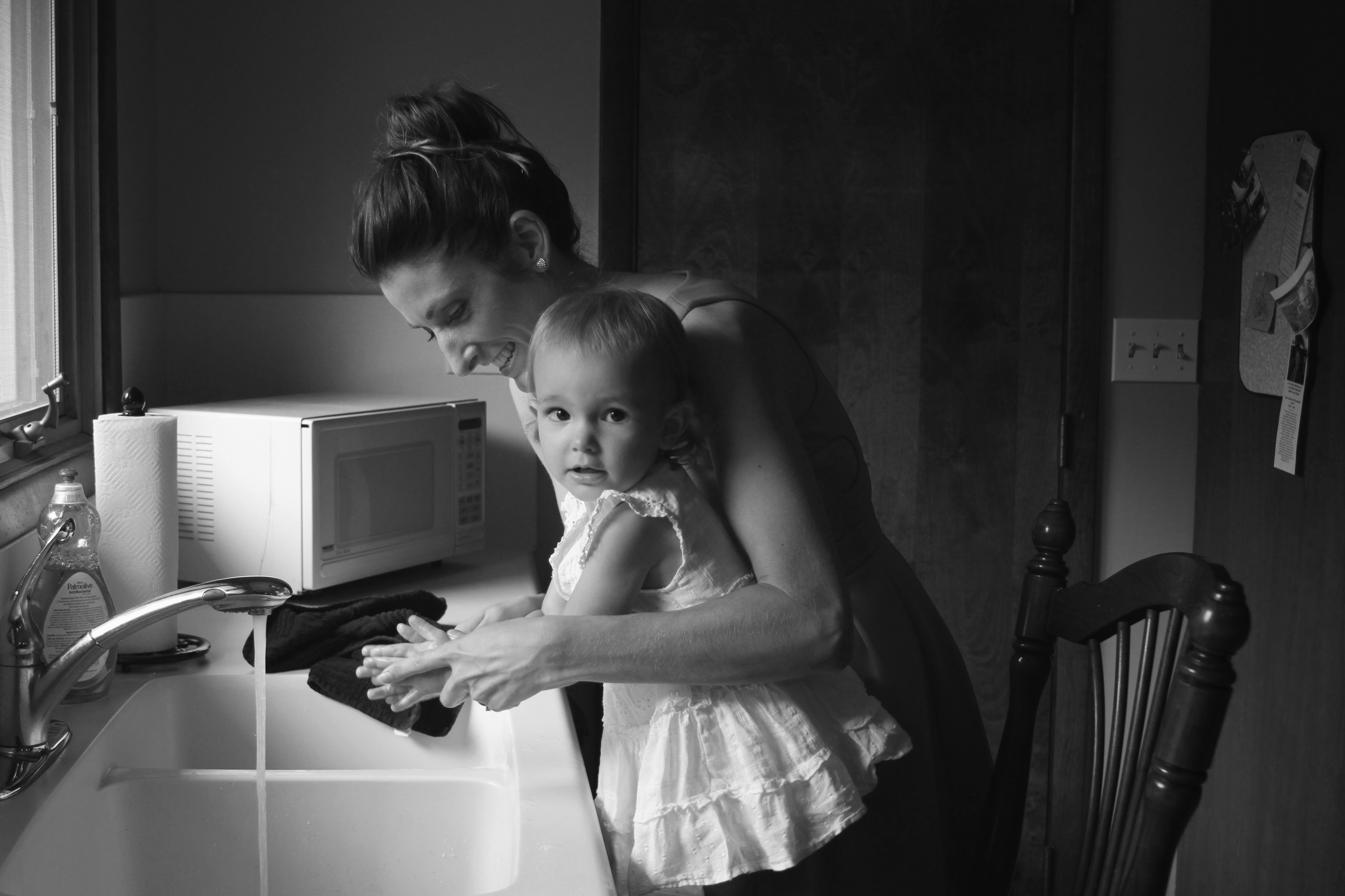 Mother and child washing hands